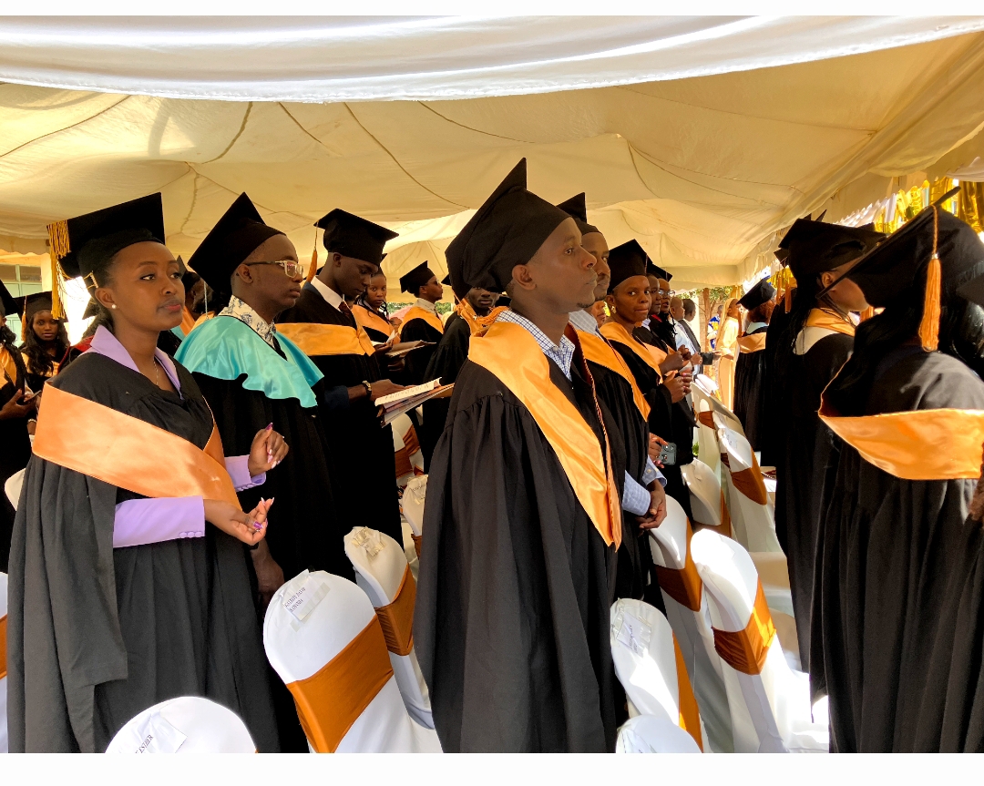 Graduands standing during the ceremony proceedings