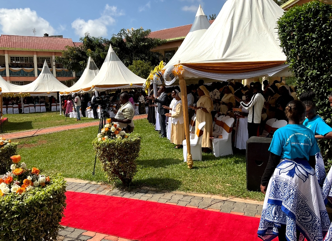 Guests seated under marquees at the college celebration grounds