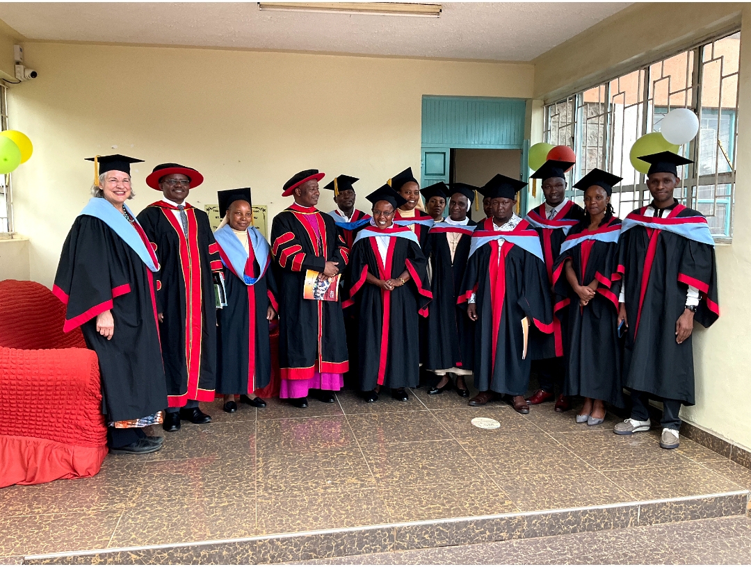College leadership and faculty group photo in full regalia